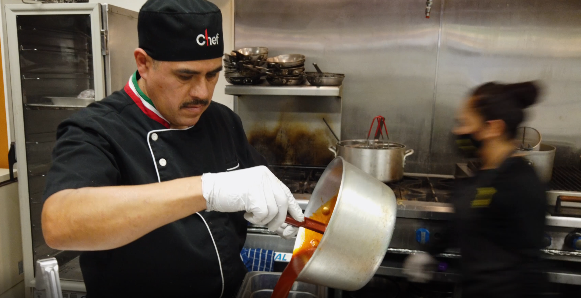 Chef in kitchen at Three Restaurant