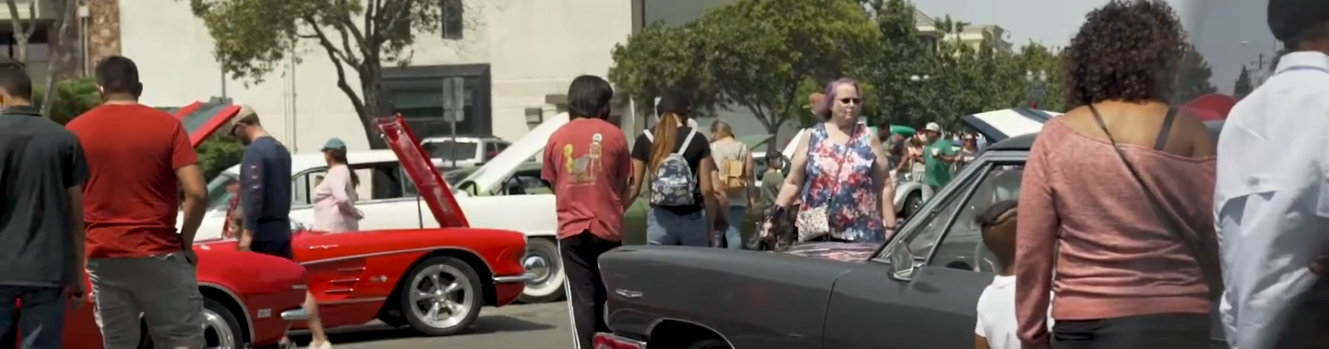 Car show enthusiasts enjoying the festival